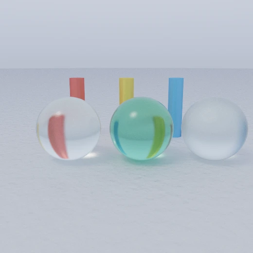 Three glass spheres in front of coloured posts: one clear, one tinted green, and one frosted, each bending the posts behind it differently.
