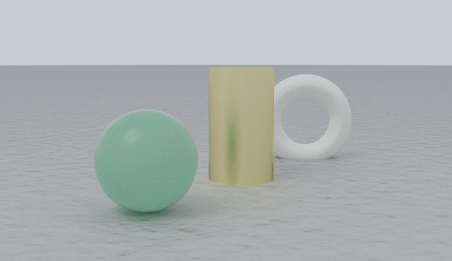 The same three objects at 85mm from three and a half times the distance: the jade sphere is the same size in the frame, but the gaps have flattened and the objects stack up.