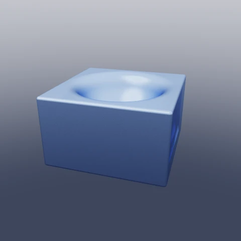 A blue slab with a sphere scooped out of its top face, the lip of the scoop rounded rather than cut.