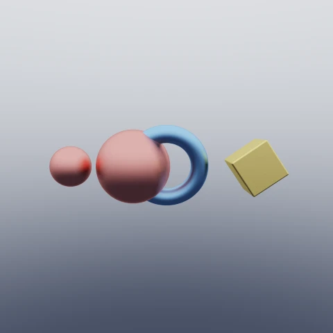 Four shapes showing the transforms: a shrunken red sphere beside a full-sized one, a blue torus tipped onto its side, and a yellow box rotated about z.